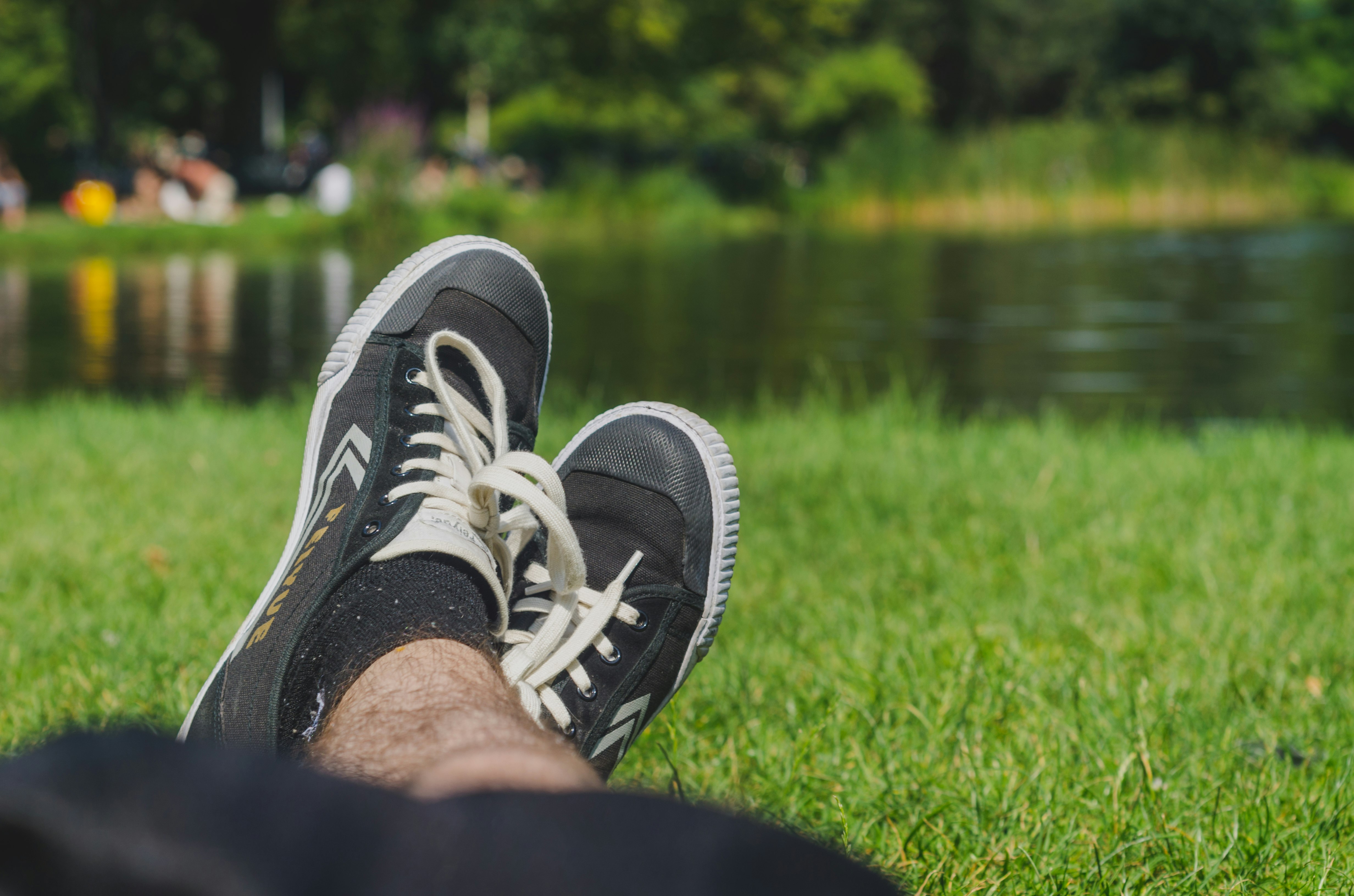 person wearing black and white sneakers